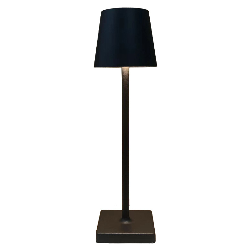 Black table lamp with a tapered shade, slim stem and square base
