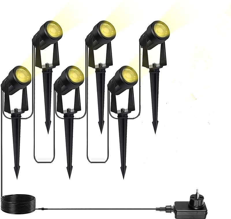 Six black garden spotlights on ground spikes connected to a cable and plug